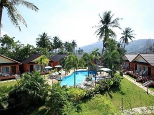 The grounds and swimming pool of this budget resort in Phuket Budget Friendly hotels in Phuket