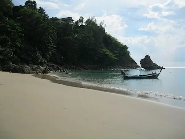 Longtail boats at the southern end of Banana Beach in Phuket. Longtail boats at the beach