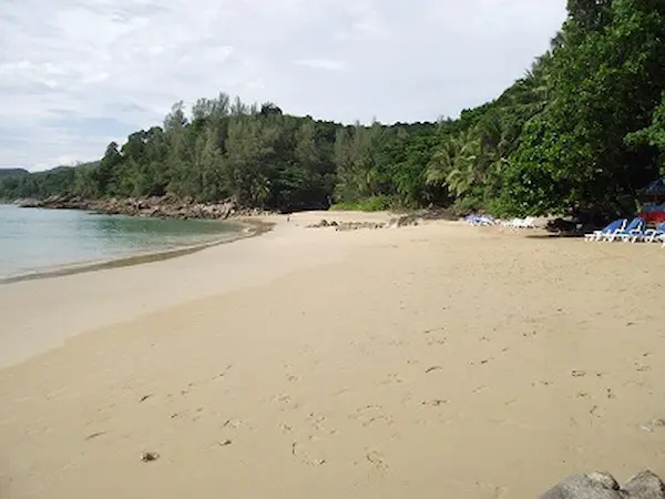 Looking north along the Banana beach Phuket to the rocks along the sand Banana beach Looking north along the beach towards the middle of the beach.