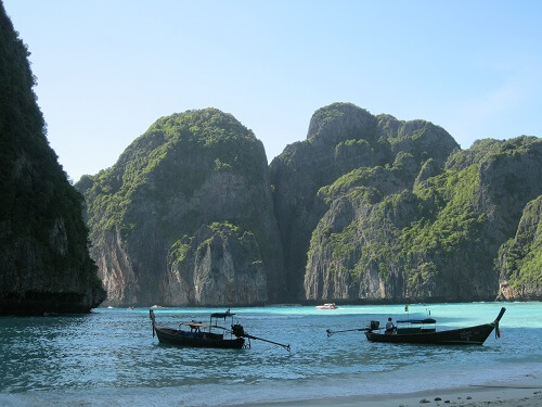 Maya Bay is protected on three sides by soaring limestone cliffs