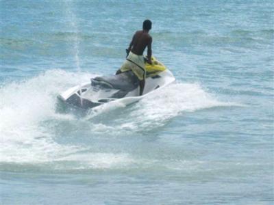 Jet ski operator before driving his ski up onto the beach