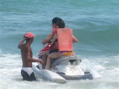 Jet ski operator giving instructions to the unlucky first timers. 