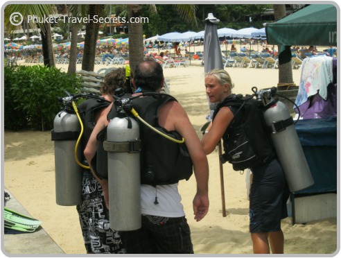 Checking the dive gear and going through checks before our first dive. Checking the dive gear and going through checks before our first dive.
