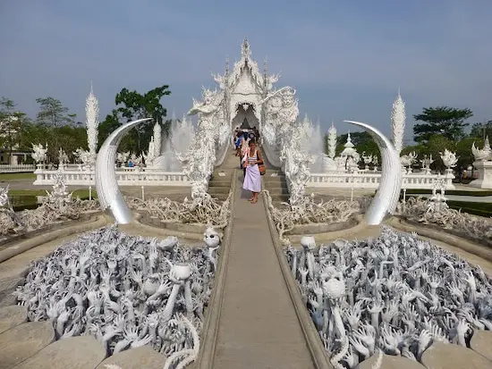Hands reaching up from the pit of hell at the White Temple in Chiang Rai. Entering Wat Rong Khun Temple
