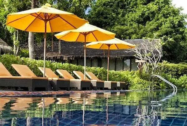 Swimming Pool, sunbeds and umbrellas at the Zeavola. Zeavola Swimming Pool